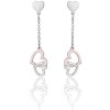 Earrings with hearts in silver and rose gold color  OK1093