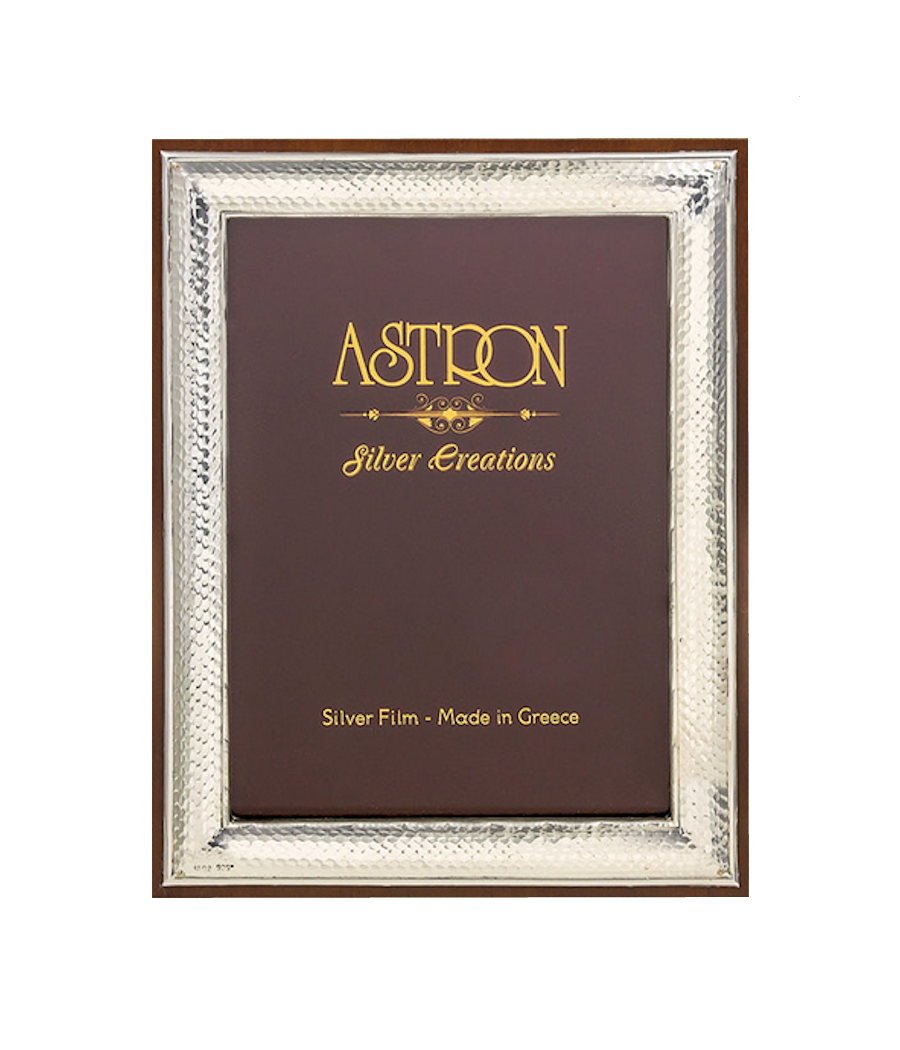 Silver-plated photo frame with wooden base and stand. Frame dimensions 22.5X17.5 centimeters.