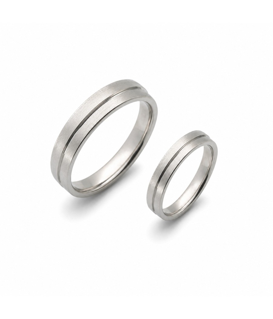 Pair of 14K white gold Comfort Fit wedding bands with engraved finish and central groove